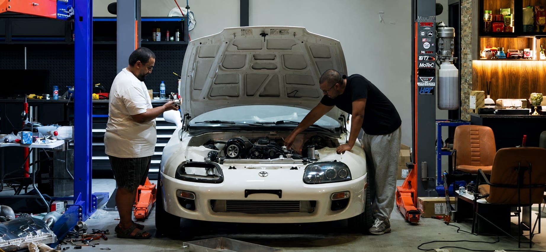 Ignite Builds technicians working on a Toyota Supra in the garage